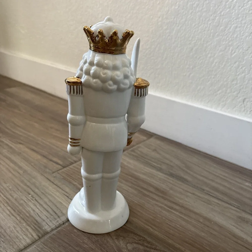 White Porcelain Nutcracker with Gold Trim Form The Holiday Aisle Figurine